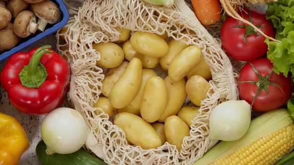 Vegetables in Reusable Net Bags on White Scratched Background, Top View. Zero Waste and Eco