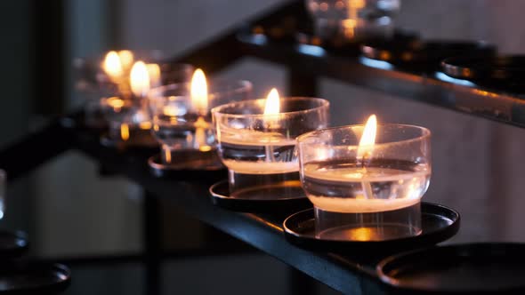 Burning Candles Inside Church Interior Prayer Candles Lit in Row Spirituality