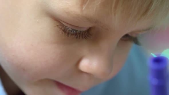 Little Kid Focused on Drawing