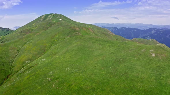 Aerial View Of Green Hill On Top Of Mountain