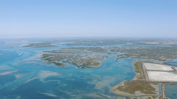 Drone shot  of Faro district Lagoon in Portugal, Europe in the Ocean 4K