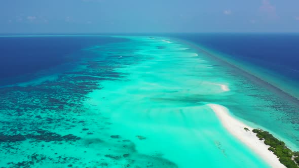 Aerial above abstract of exotic tourist beach journey by shallow ocean with white sand background of