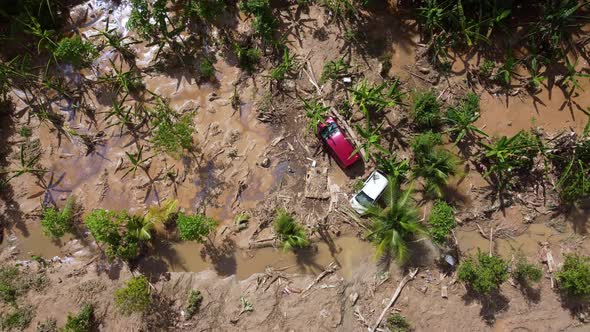 Aerial top down view car is trapped in mud after disaster flash flood