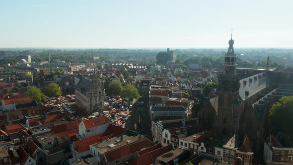 Sint Jan Church And Old Town Hall Building In Downtown Gouda, Netherlands During Daytime - aerial dr