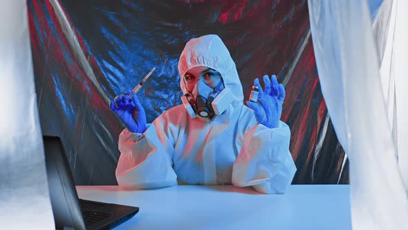 Doctor or Scientist in Laboratory Holding Liquid Vaccines Coronavirus and Dancing alt