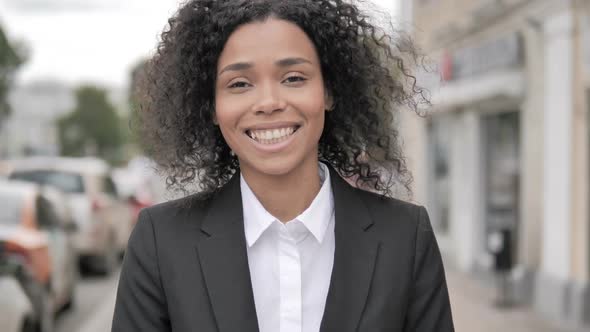 Portrait of Smiling African Businesswoman Standing Outdoor Along Road