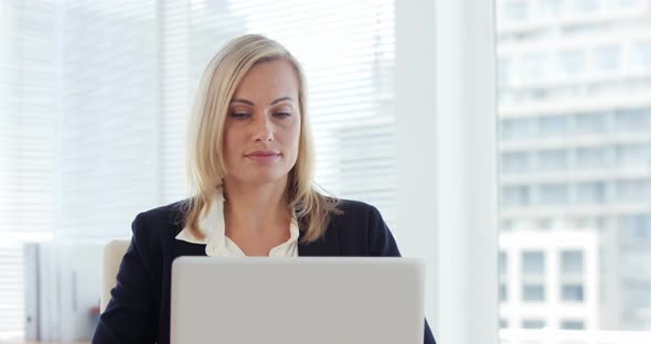 Businesswoman working on laptop