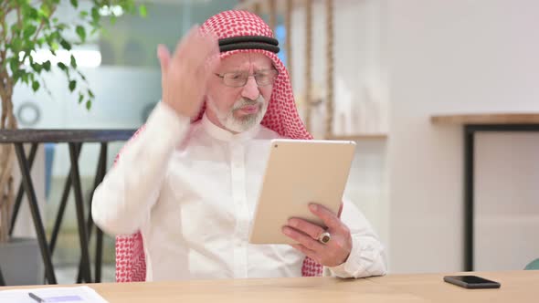 Upset Senior Old Arab Businessman Reacting To Loss on Tablet