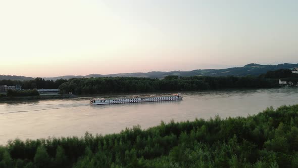 River cruise ship traveling down the river Danube in upper Austria.