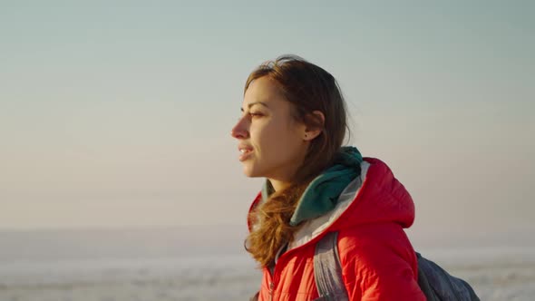 Slow Motion of Woman Traveler Meeting Sunrise at Sea Beach