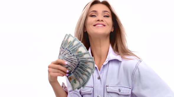 Rich Woman Posing with Cash Fan Enjoying Financial Independence