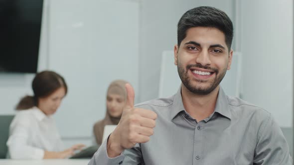 Portrait of Happy Smiling Arab Male Business Leader Making Thumb Up Like Gesture at Camera