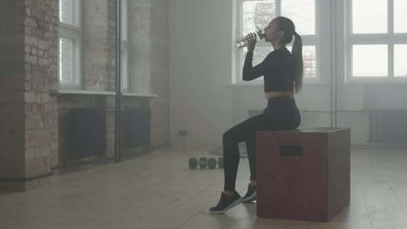 Fit Woman Resting Between Sets