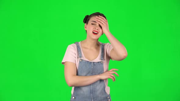Girl Listens To Information Looking at Camera, Is Shocked and Very Upset on a Green Screen