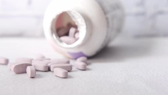 Close Up of Many Vitamin Pills on White Background