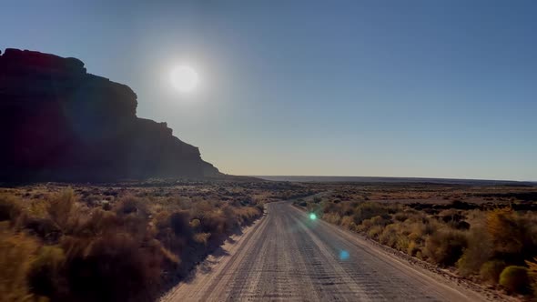 Driving past the rock formations of the Valley of the Gods