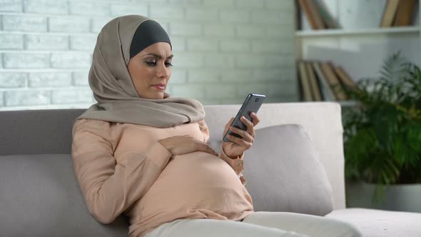 Sad Expecting Woman Scrolling Smartphone App, Pregnancy Tiredness, Discomfort