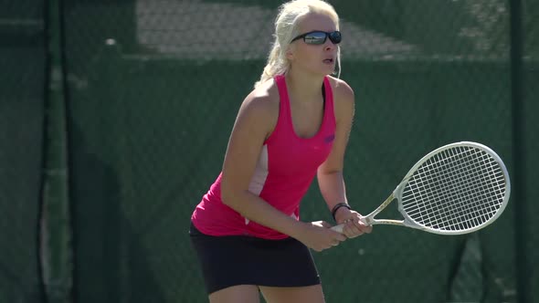 Women playing tennis.