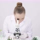 Female Biochemical Researcher Looking Through Microscope GMO Plant Green Leaf - VideoHive Item for Sale
