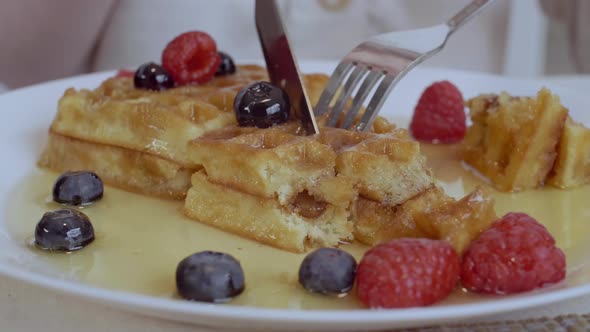 Unrecognizable Person Eating Delicious Belgian Waffles