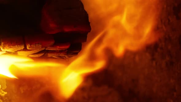 Closeup Slow Motion of Bright Cinematic Orange Red Flames From Firewoods Night