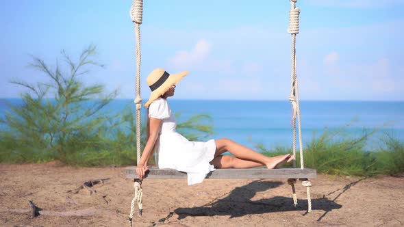 Asian woman enjoy around beautiful beach sea ocean