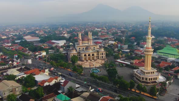 Al-Aqsa Klaten Mosque with Merapi and Merbabu mounts shrouded in fog in background, Central Java, In