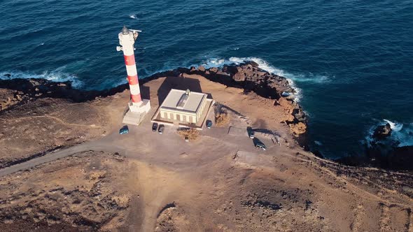 Scenic Aerial View of a Lighthouse in Volcanic Coastline Landscape. Tenerife, Canary Islands, Spain