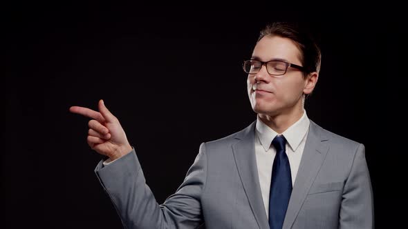 Studio portrait of successful and smart businessman in suit and tie.