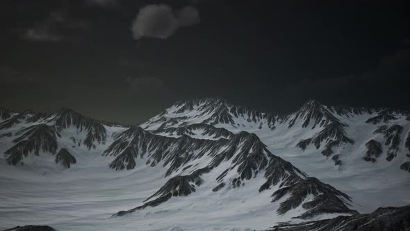 Mountains in Evening Cloudy Sky