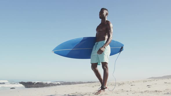 African American man ready to go surf