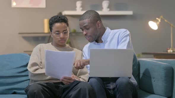 Couple with Laptop Having Failure While Reading Documents