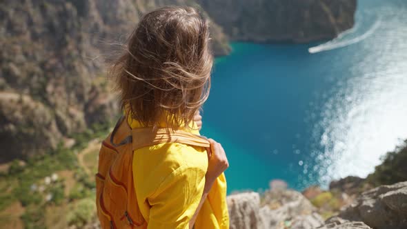 Slow Motion Happy Traveler Freedom Filling Woman with Open Arms Smiling and Enjoying Sea Coast View