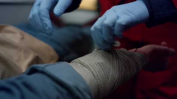 Doctor Giving First Aid Help to Patient