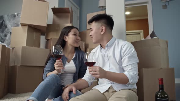 Couple Drinking Wine in New Apartment