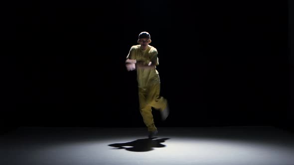 Breakdance Dancer in Yellow Suit Dance on Black, Shadow
