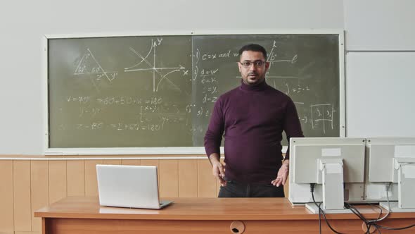 Maths Professor Teaching Geometry in Auditorium