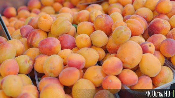 4K Close-up of Peaches For Sale at a Market