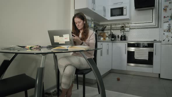 Cheerful Woman Typing On Her Smartphone