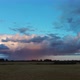 Crop Field After Rain and Storm Clouds in Background Rural Countryside, Aerial Dron Shot - VideoHive Item for Sale