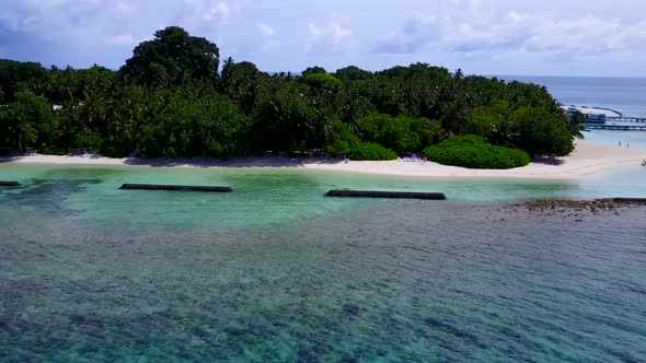 Aerial travel of tourist beach by blue ocean with sand background