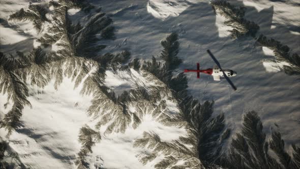 Helicopter Above Mountains in Snow