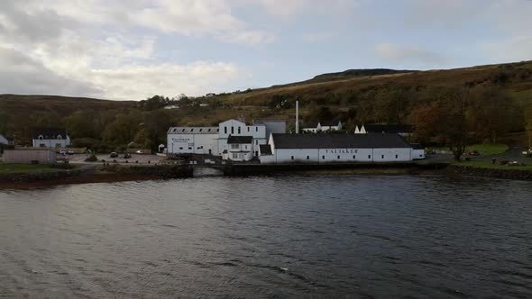 Aerial of Carbost Village and a Distillery in Skye Scotland