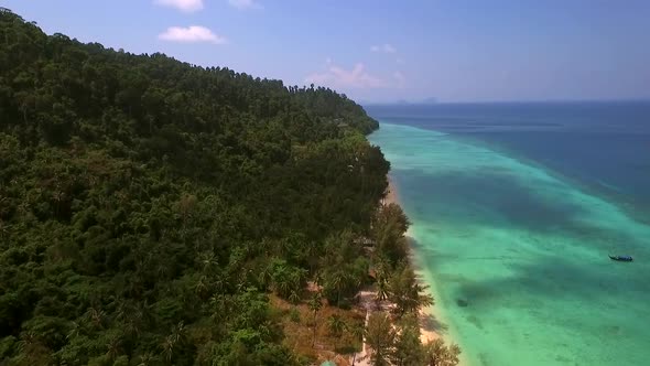 Aerial view of coastline in sea on Koh Rok Yai island in Thailand.