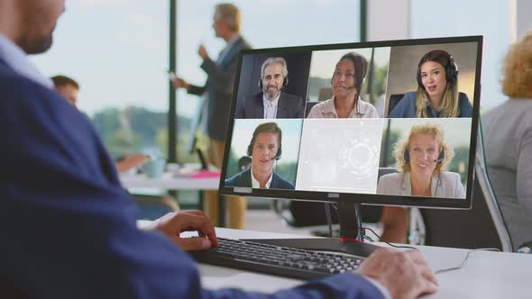 Man listening to colleagues in call