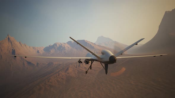 Advanced armed military drone (UAV) flying smoothly over a vast desert. 4K
