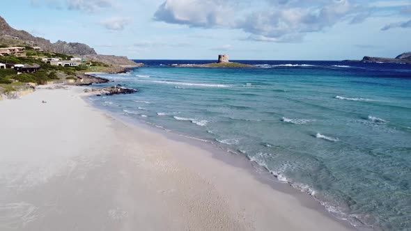 wonderful drone flight from a paradisiacal white picture book beach in sardinia (la pelosa)