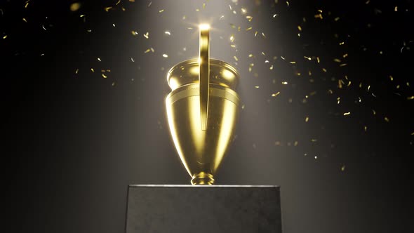 Golden metallic trophy cup on the platform. Award for a winner. Falling confetti