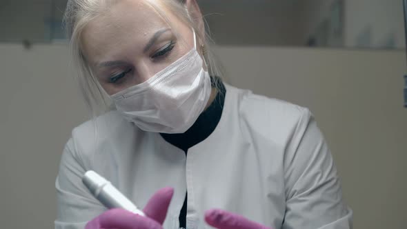 Lady with Blond Ponytail Applies Permanent Eyebrow Make-up