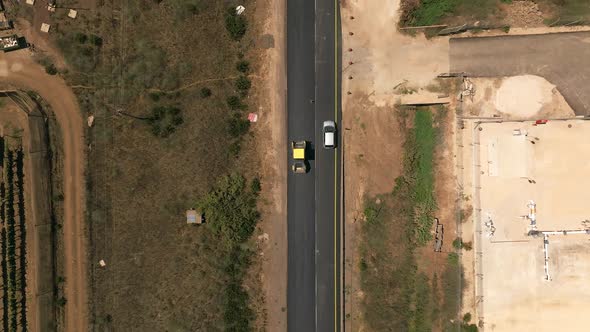 New road paving pressed by a road roller, Top down aerial view.
